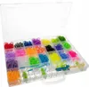 A clear, well-lit studio shot of a plastic organizer box filled with colorful rubber bands and crafting tools. Náhľad obrázku produktu