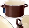 A brown enamel pot with a cream interior, shown on a white background. A blue tag with the brand name 'orion' is attached to the handle. Voir les images du produit