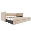 A beige upholstered daybed with a pull-out trundle bed and storage drawers, shown from a three-quarter angle against a white background. Podgląd zdjęcia produktu