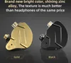 Two in-ear headphones, one gold and one black, are displayed against a dark gray background. Podgląd zdjęcia produktu
