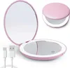 A pink compact mirror with a built-in LED light is shown open and closed, along with a USB charging cable. Produktbild-Vorschau
