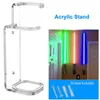A collage showing an acrylic stand for lightsabers and a separate image of lightsabers displayed on a wall, along with screws and wall plugs. Voir les images du produit