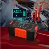 A person is using a car battery charger to charge a car battery. Produktbild-Vorschau