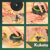 A collage of four images showing a manual food chopper being used to chop garlic. Produktbild-Vorschau