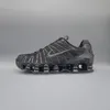 A black Nike Shox TL sneaker is shown against a plain gray background. Produktbild-Vorschau