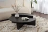 A modern living room scene with a couch, coffee table, and rug. Produktbild-Vorschau
