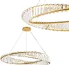 Two golden ring-shaped chandeliers with clear crystal accents are shown against a white background. Produktbild-Vorschau