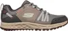 A side view of a single grey Skechers sneaker against a white background. Voir les images du produit