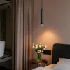A bedroom scene with a pendant light, flowers, and a bathtub visible in the background. Anteprima dell’immagine prodotto