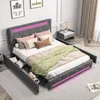 A bedroom scene featuring a bed with storage drawers and LED lighting.