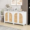 A white sideboard with rattan doors is displayed in a room with decorative items on top. Anteprima dell’immagine prodotto