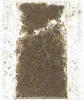 A top-down view of a clear plastic bag filled with shredded material, likely cat litter or bedding, with some larger pieces mixed in. Produktbild-Vorschau