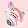 A pair of pink and white cat-ear headphones with RGB lighting. Náhľad obrázku produktu