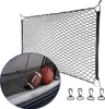 A black cargo net for a car trunk, shown with two balls inside. Voir les images du produit