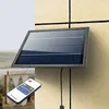A solar panel mounted on a wall, with a remote control in the foreground. Podgląd zdjęcia produktu