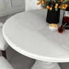 A close-up shot of a white round table with a transparent protective cover. Náhled obrázku produktu