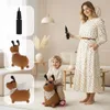 A mother and child in a living room, with close-ups of a toy dog and a pump. Produktbild-Vorschau
