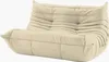A beige two-seater sofa with a tufted design. Produktbild-Vorschau