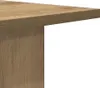 A close-up view of the corner of a wooden table or shelf. Náhľad obrázku produktu
