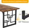 A close-up of a desk with a rustic brown wood top and black metal legs, highlighting the thickness of the legs. Anteprima dell’immagine prodotto