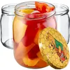 Three glass jars, one filled with colorful bell pepper slices, and a decorative lid with a Winnie the Pooh illustration. Produktbild-Vorschau
