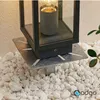 A close-up of a garden light anchor base installed in white gravel. Anteprima dell’immagine prodotto