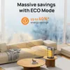 A heater is placed on a side table next to a sofa in a living room, with a large window in the background. Produktbild-Vorschau