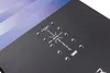 A close-up view of a snowboard's binding area, showing the mounting holes and branding. Produktbild-Vorschau