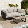 An outdoor patio setting with a sectional sofa and coffee table. Anteprima dell’immagine prodotto
