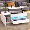 A modern living room scene with a white coffee table in the foreground and a gray sofa in the background. Anteprima dell’immagine prodotto