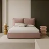 A bedroom scene with a pink upholstered bed as the main focus. Produktbild-Vorschau