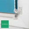 Close-up of a roller blind mechanism with a turquoise fabric. Produktbild-Vorschau