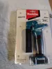 A product in its retail packaging, likely a work light. Podgląd zdjęcia produktu