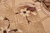 A close-up view of a carpet with a floral pattern. Produktbild-Vorschau