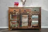 A rustic, multi-colored wooden sideboard against a textured gray and white wall. Náhled obrázku produktu