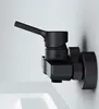A black faucet is mounted on a white wall above a white sink. Produktbild-Vorschau
