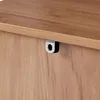 A close-up view of a metal D-ring attached to the edge of a wooden surface, likely part of a piece of furniture. Anteprima dell’immagine prodotto