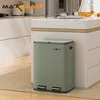 A green dual-compartment trash can with foot pedals is placed on a rug in a modern kitchen. Náhľad obrázku produktu