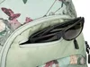 A close-up view of a backpack pocket with sunglasses inside. Produktbild-Vorschau