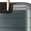 A close-up of a teal suitcase with a textured surface and a black handle attachment. Produktbild-Vorschau