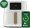 A Philips air fryer is shown next to a smartphone displaying the NutriU app. Náhled obrázku produktu