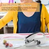 A person is demonstrating a mini handheld sewing machine with spools of thread. Produktbild-Vorschau