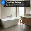 A modern bathroom with a freestanding bathtub, sink, and wooden vanity. Produktbild-Vorschau