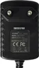 A close-up view of the back of a black power adapter with text and regulatory symbols. Produktbild-Vorschau
