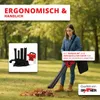 A woman is using a leaf blower in a park setting. Produktbild-Vorschau
