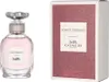 A bottle of Coach Dreams Eau de Parfum and its packaging are displayed side-by-side against a white background. Voir les images du produit