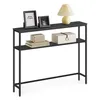 A console table with two shelves, decorated with picture frames, a lamp, books, and a decorative box. Náhled obrázku produktu