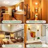 Collage of four different interior scenes: a kitchen/dining room, a hallway, a living room, and a bathroom. Produktbild-Vorschau