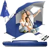 A family is sitting inside a blue beach tent. Voir les images du produit