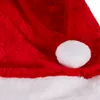 A close-up view of a red Santa hat with a white pom-pom and trim. Podgląd zdjęcia produktu